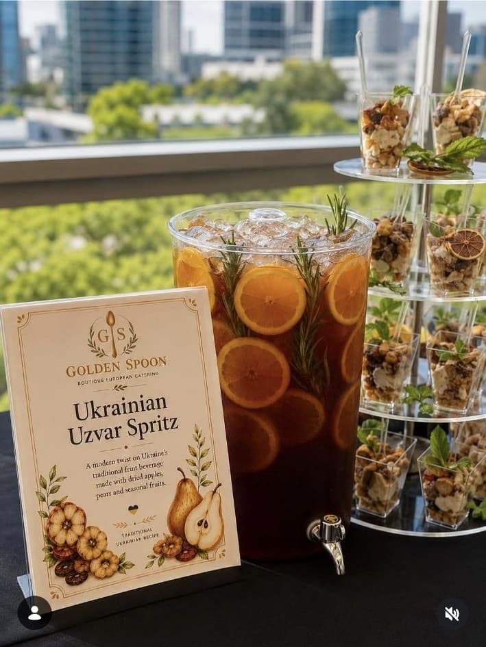 Ukrainian Uzvar Spritz dispenser with Golden Spoon signage and parfait cups.